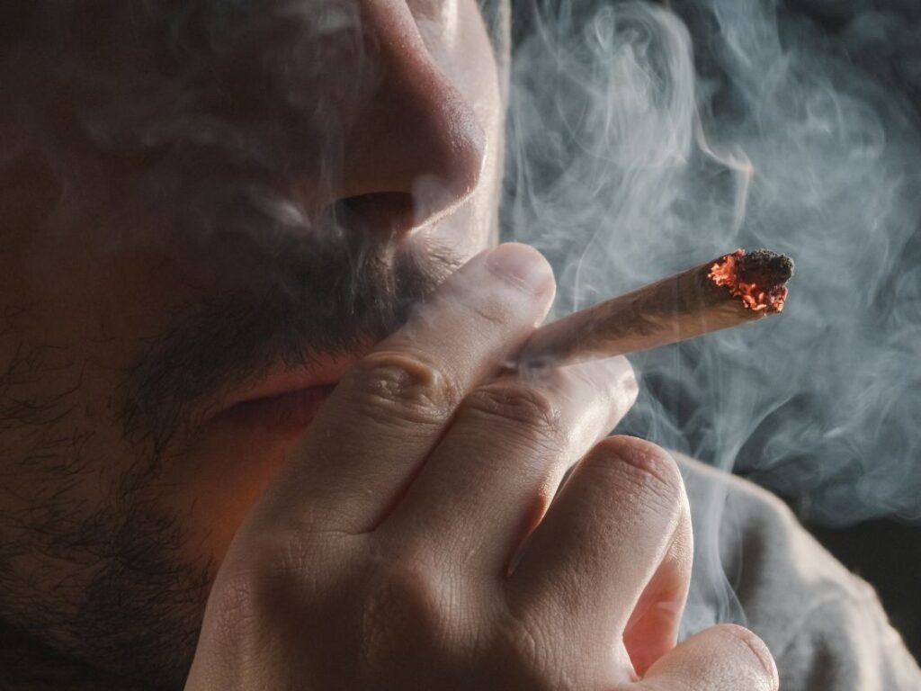 man smoking joint
